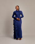  Amira Dress in navy blue with high neckline and bow tie detail.

