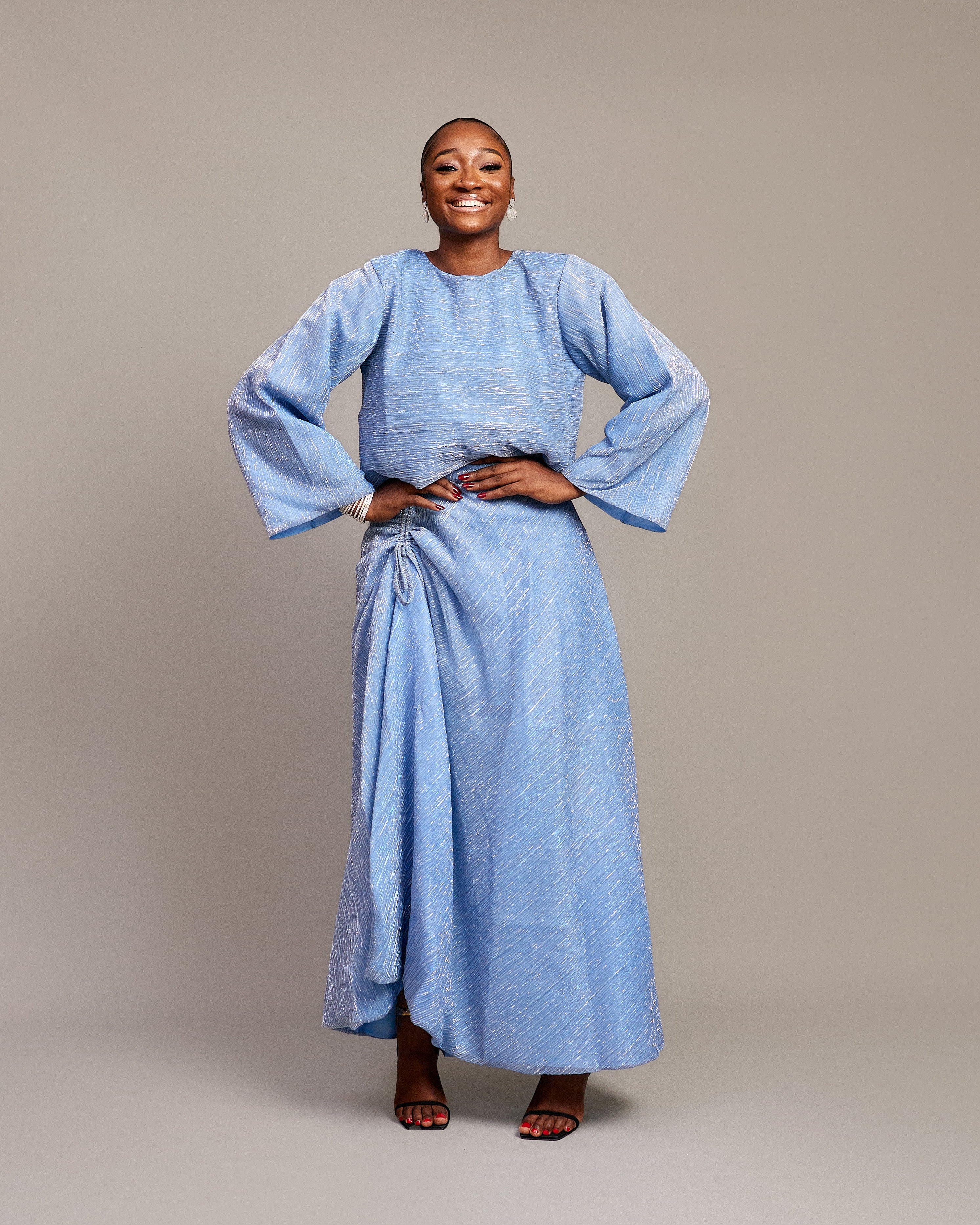 Light blue Celestial Plain Two Piece with pleated fabric and ruched skirt.

