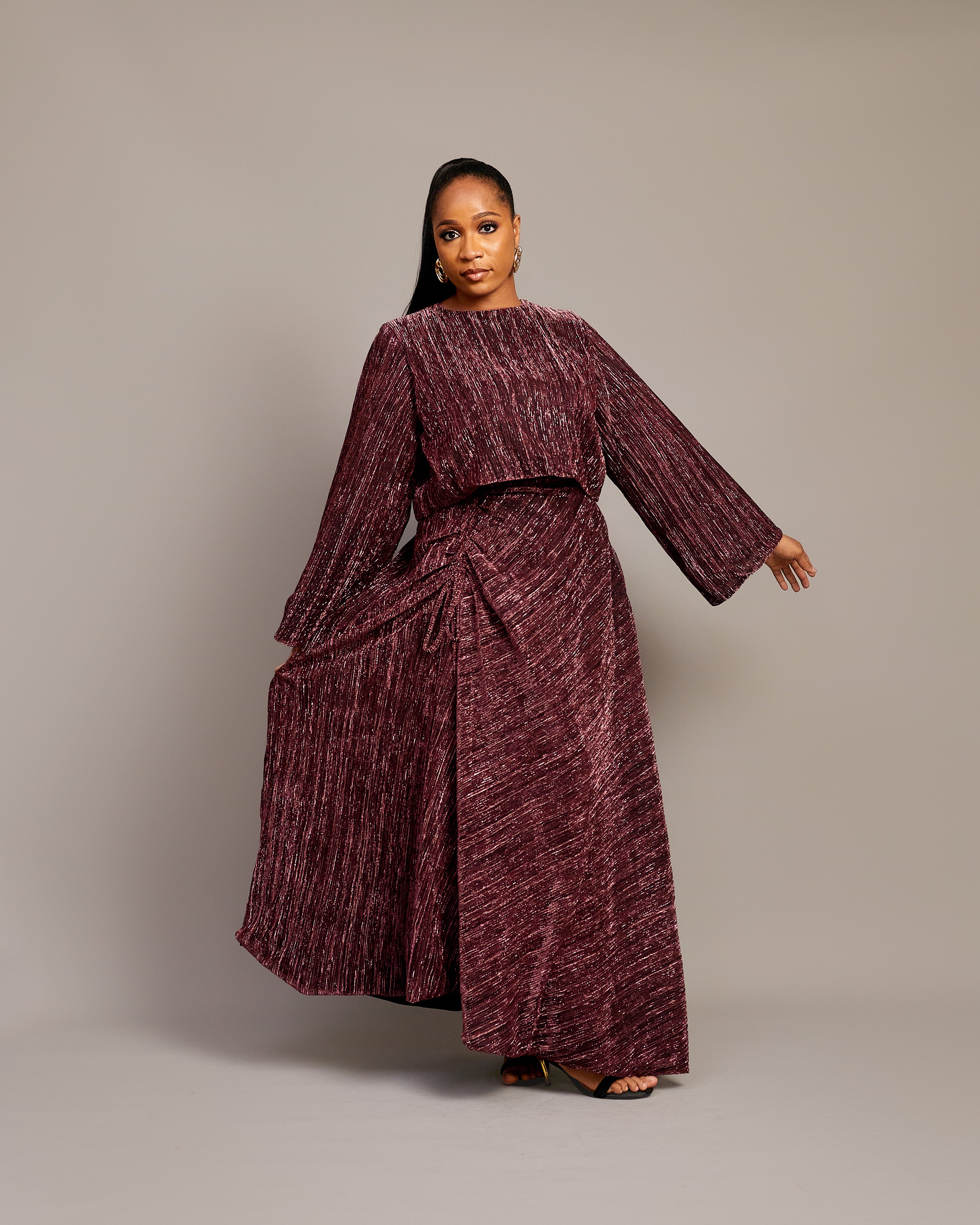 Elegant ruched maxi skirt and matching blouse in shimmering fabric.