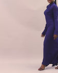  Amira Dress in navy blue with high neckline and bow tie detail.
